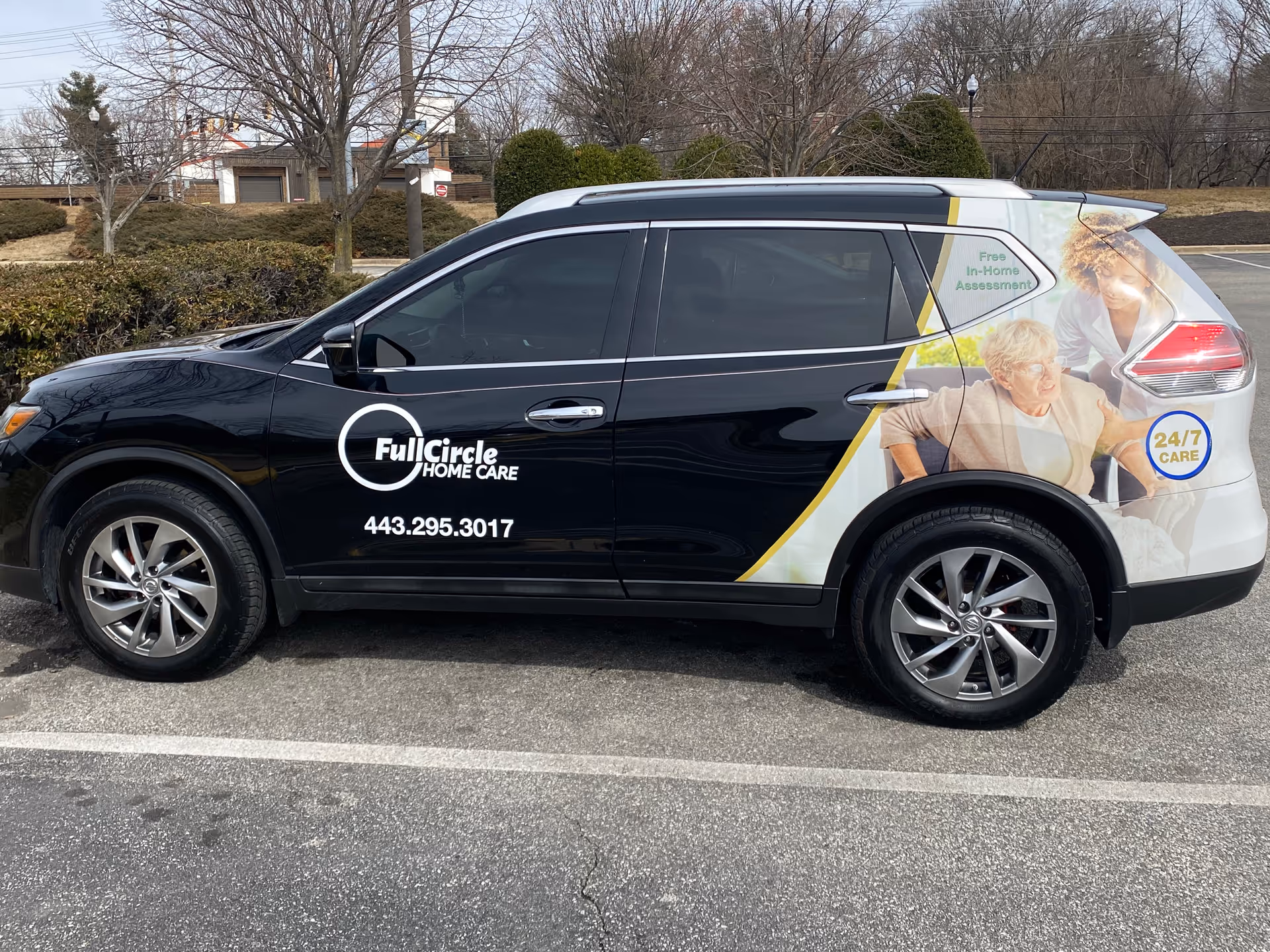Black Full Circle Home Care van with logo and phone number parked in a parking lot.