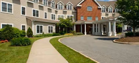 Brookdale Attleboro senior living building exterior with curved driveway and covered entrance.