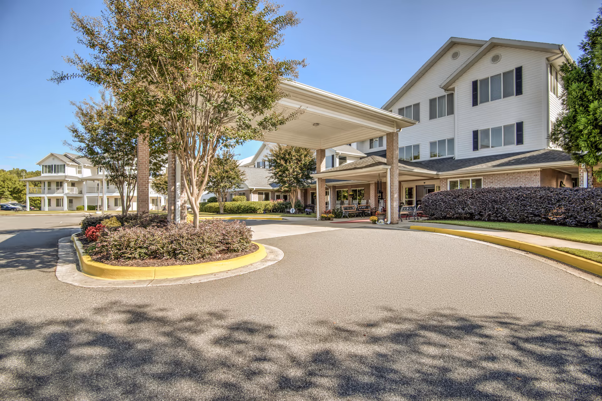Senior living facility TerraBella Epps Bridge exterior with covered entrance and circular driveway.