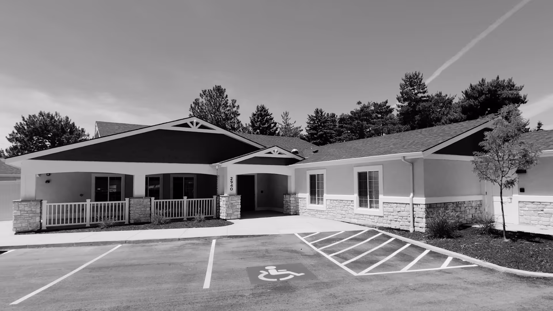 Exterior view of BrightStar Care Homes Memory Care at Settlers with a covered entrance.
