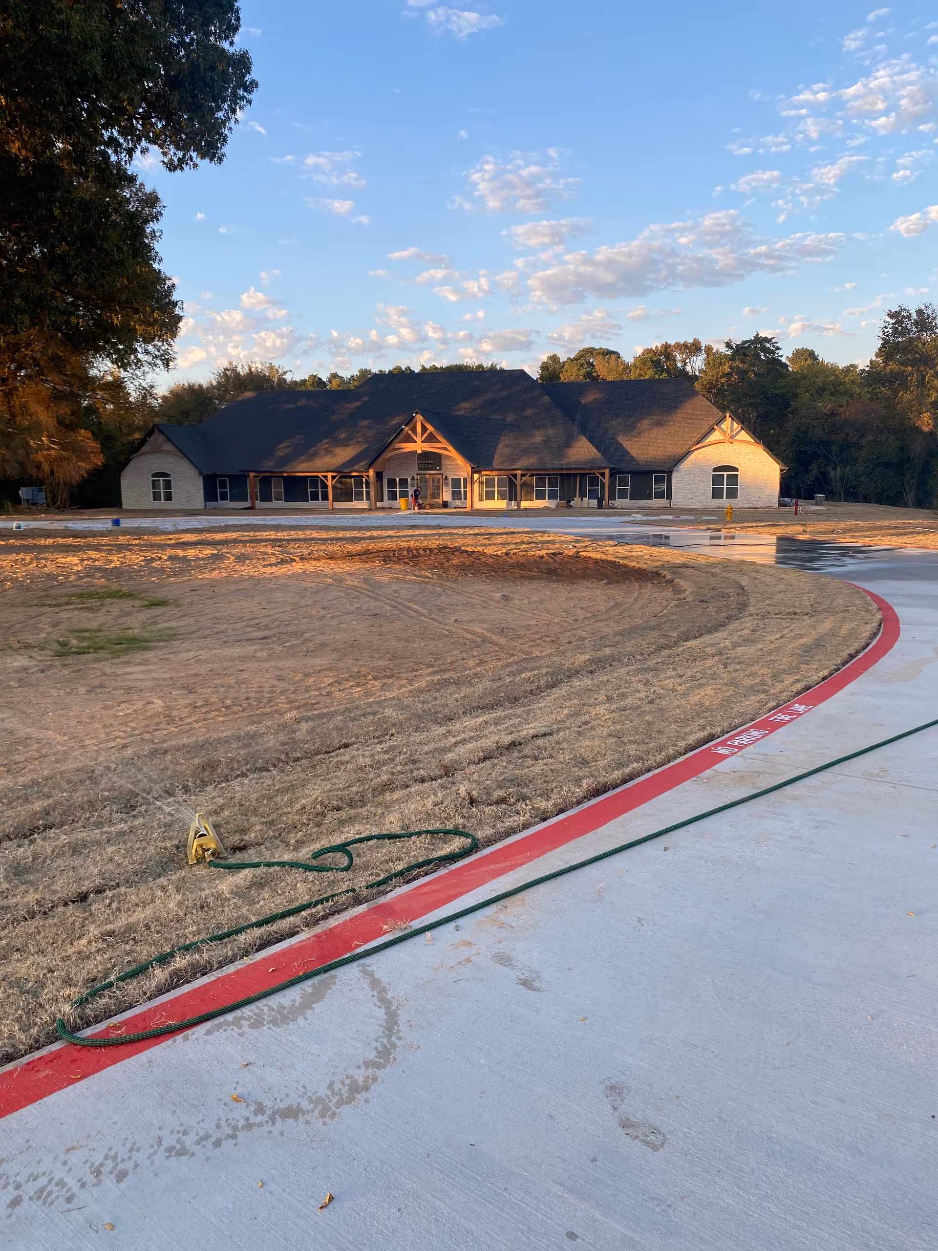 Exterior view of McKee Assisted Living and Memory Care facility with curved entry driveway.