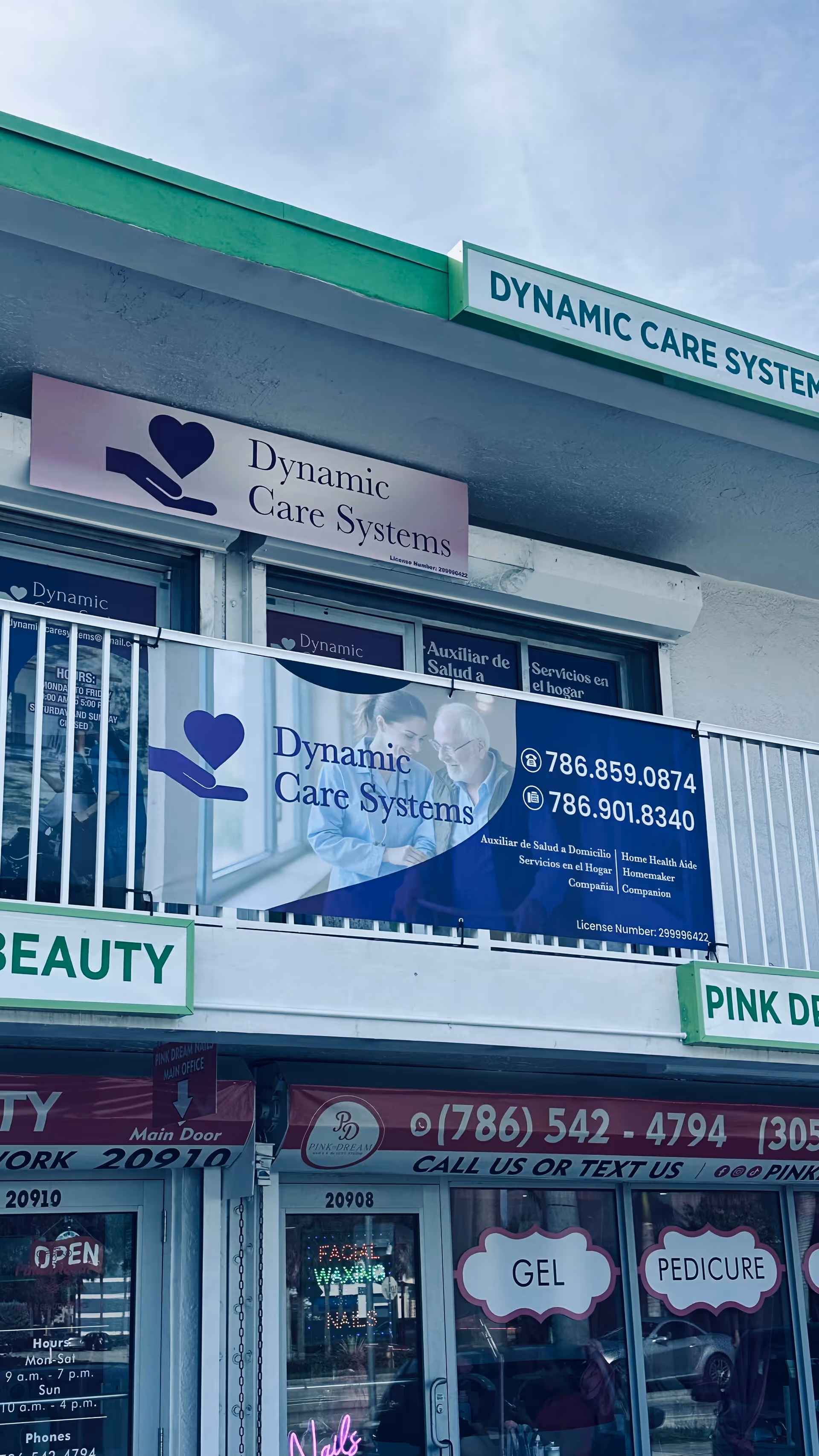 Front exterior of a facility with Dynamic Care Systems signage and banners.