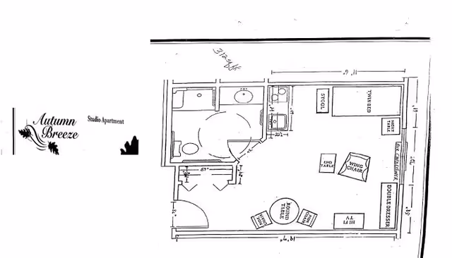 Black and white floor plan of a studio apartment labeled Autumn Breeze with furniture layout.