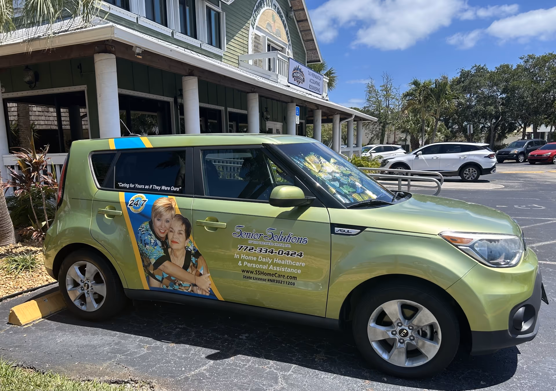 Green Senior Solutions van parked outside a senior care facility.