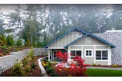 Single-story residential-style facility with a front entrance and landscaped shrubs.