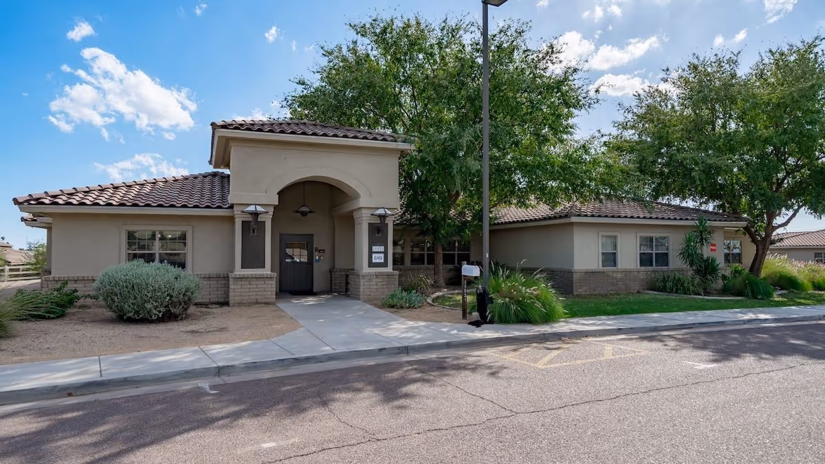 Front exterior of Lifestream at Youngtown, a single-story building with tiled roof and landscaping.