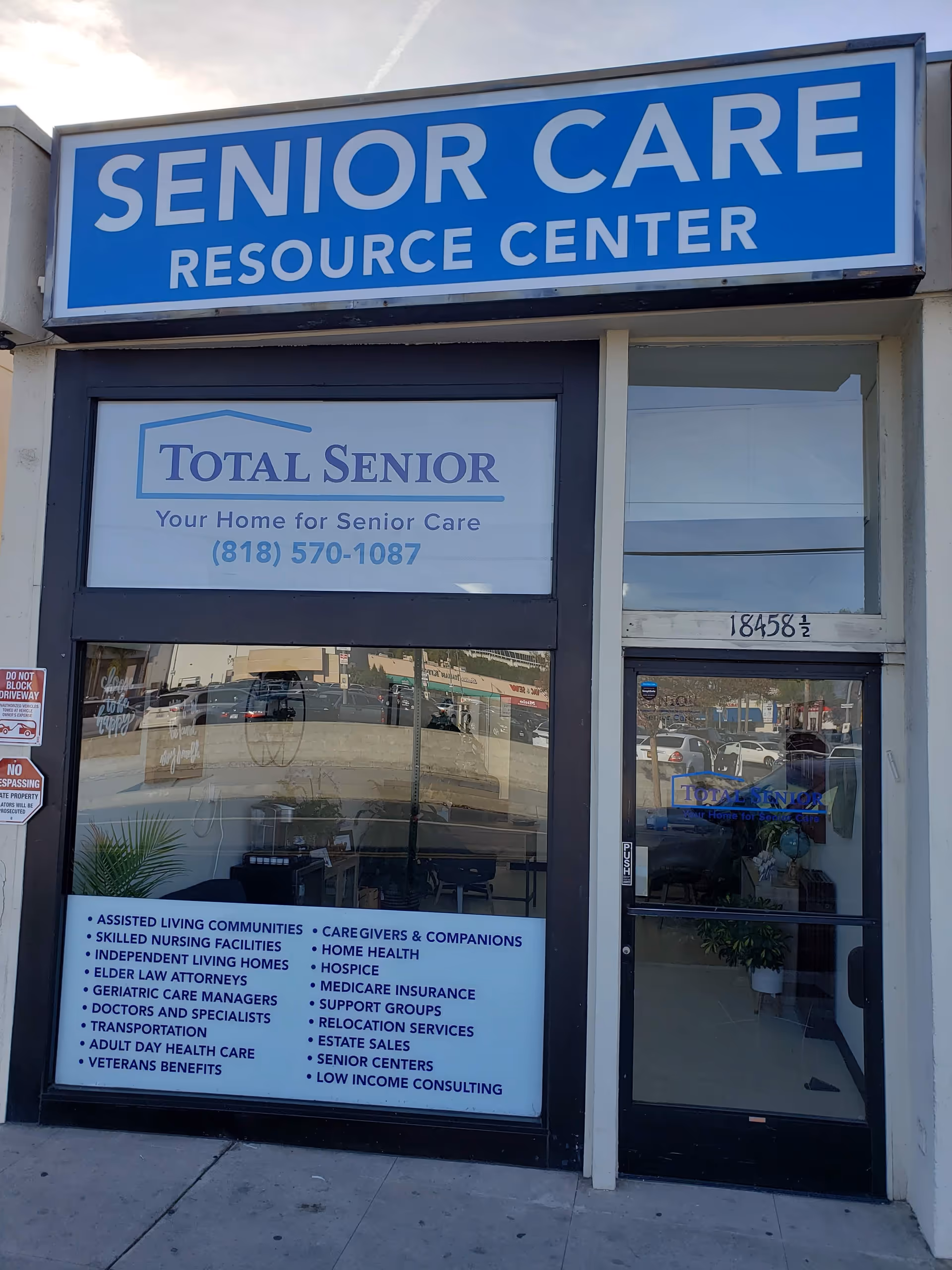 Front of a senior care facility featuring a large blue Senior Care Resource Center sign.