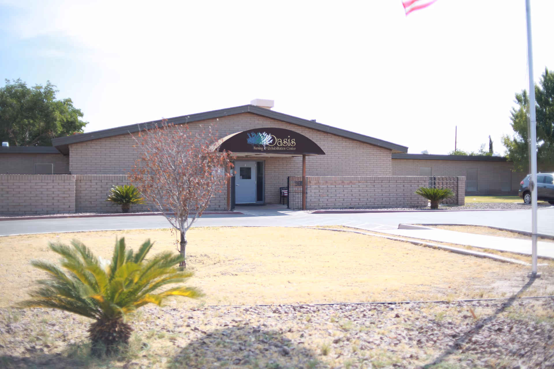 Front exterior view of Oasis Nursing and Rehabilitation Center with a brick entrance.