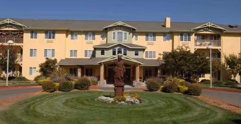 Exterior view of Solstice Senior Living at Santa Rosa, showing entrance and circular driveway.