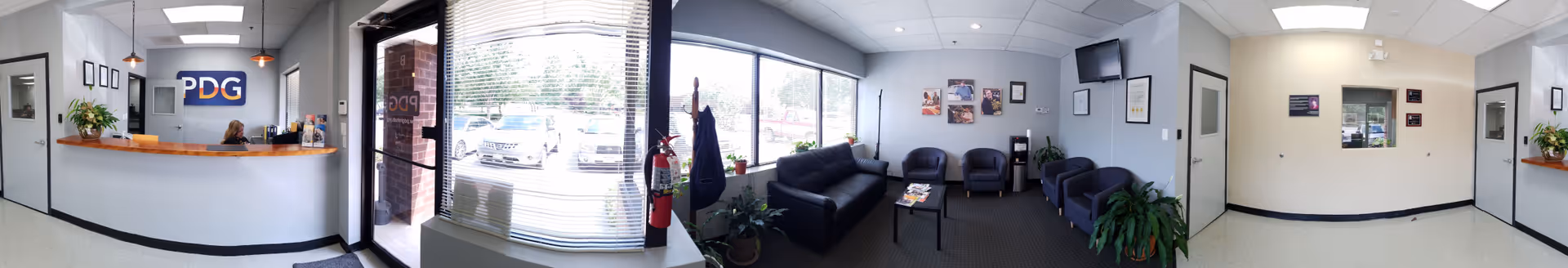 Reception area of a senior living facility with PDG sign and seating.