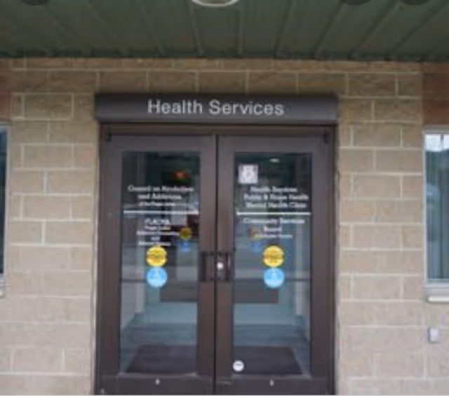 Exterior entrance labeled Health Services at Schuyler County Public Health.