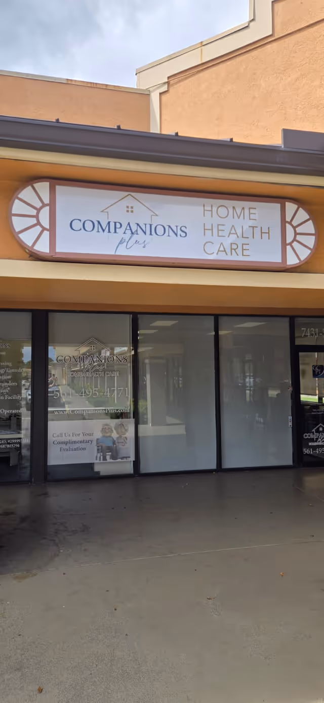 Exterior storefront with Companions Plus Home Health Care sign and glass doors.