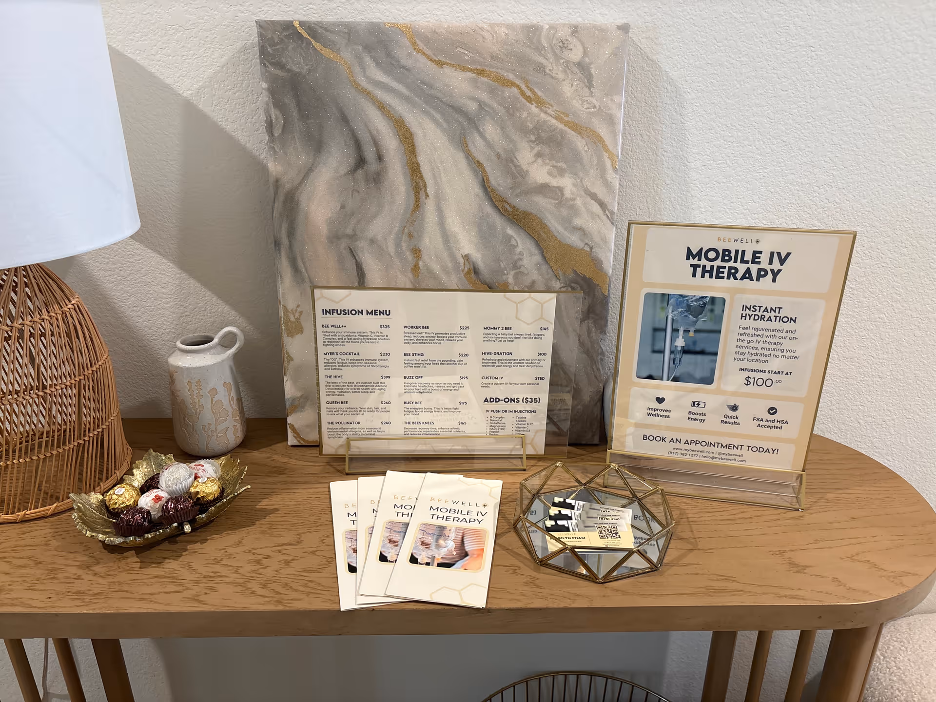 Reception table displays IV therapy brochures and decorative items inside an interior facility.