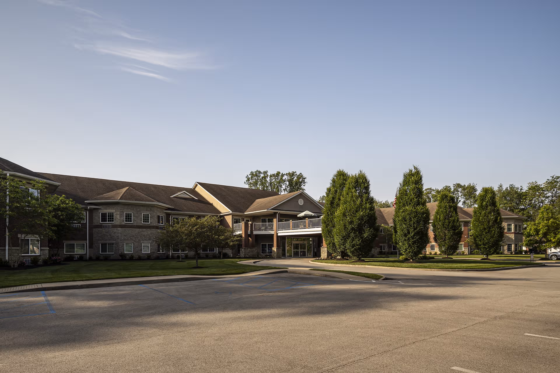 Exterior view of Magnolia Springs East Louisville senior living facility entrance and landscaped grounds.