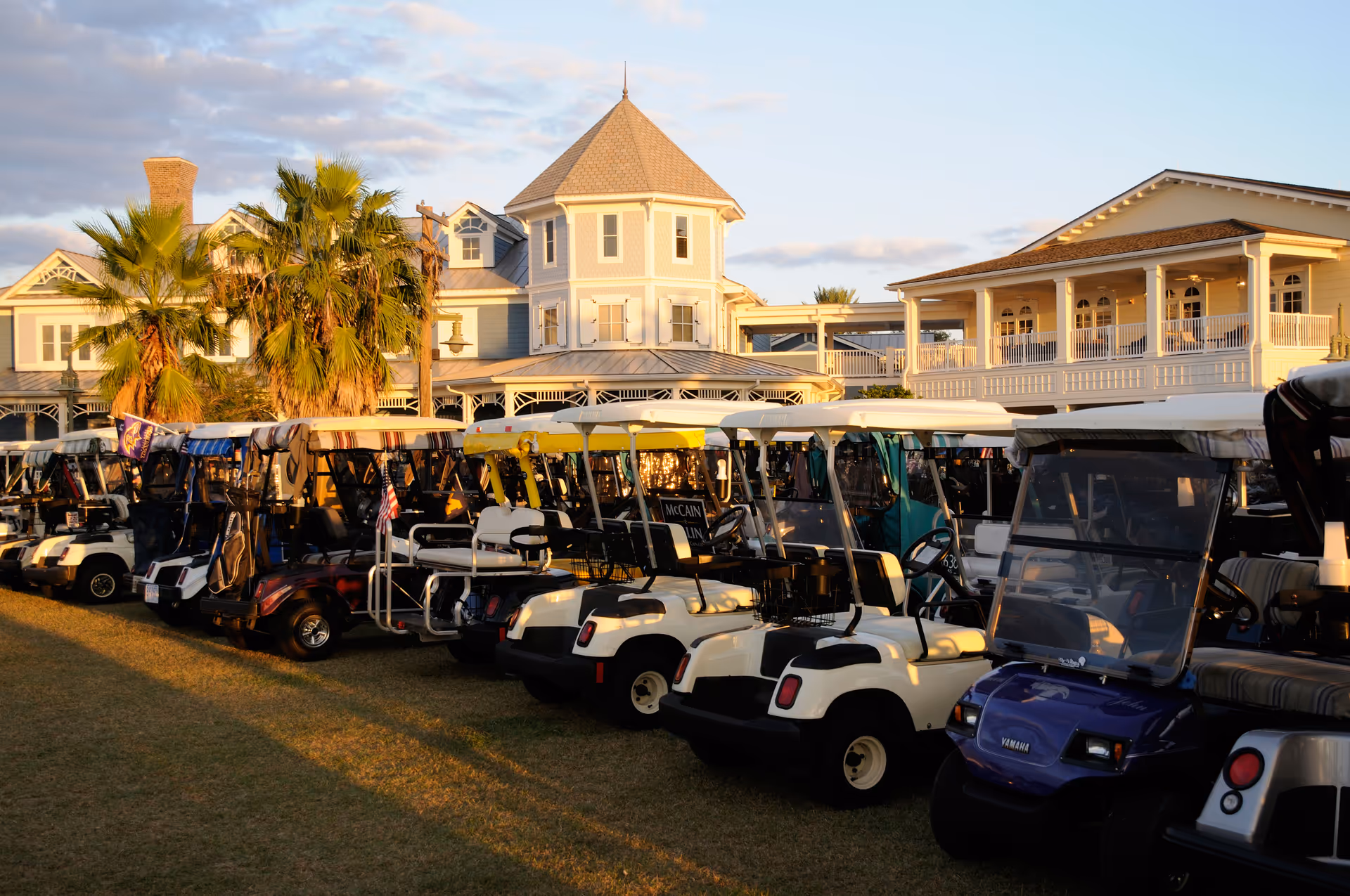 Exterior view of The Willows senior living campus with multiple golf carts lined up in front.