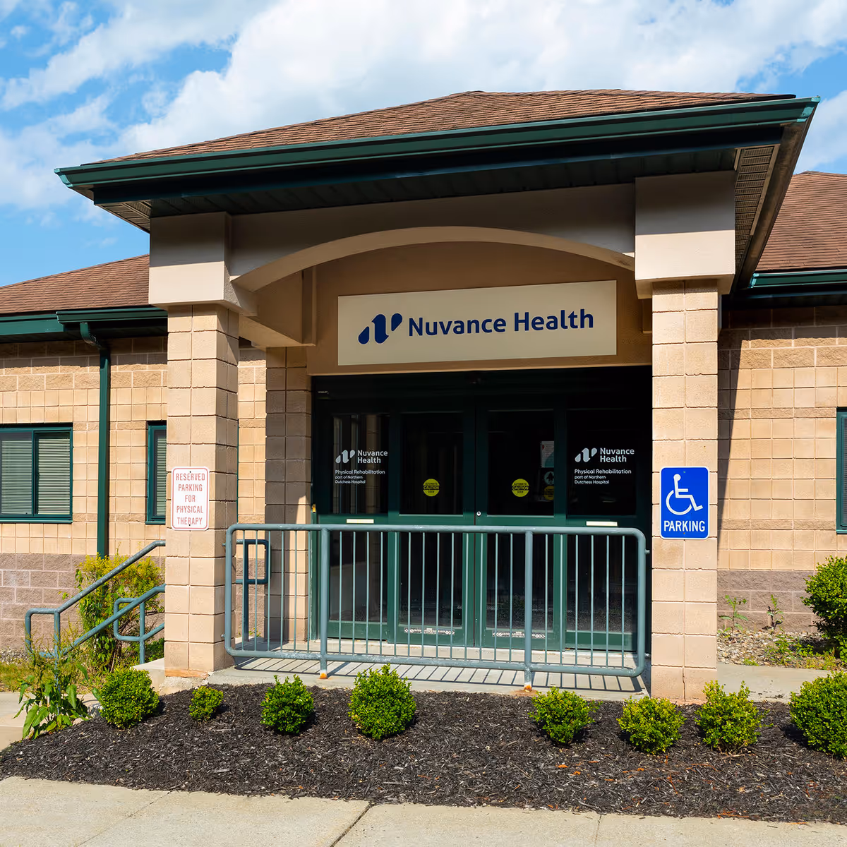 Exterior view of a facility entrance with Nuvance Health sign