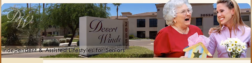 An exterior view of Desert Winds Assisted Living facility with a sign displaying its name and address. In the foreground, an elderly woman in a red top is smiling and holding a decorative birdhouse, while a younger woman beside her is smiling and holding a bouquet of flowers. Palm trees and the building are visible in the background.