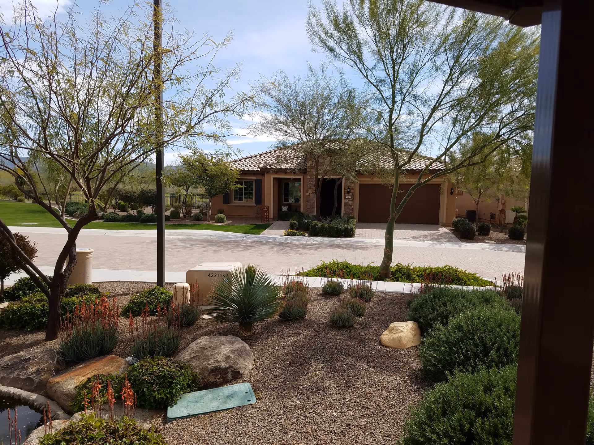 Front view of Sun City Festival facility with desert landscaping and driveway.