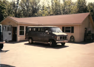 Exterior view of Birchwood facility with a parked van in front