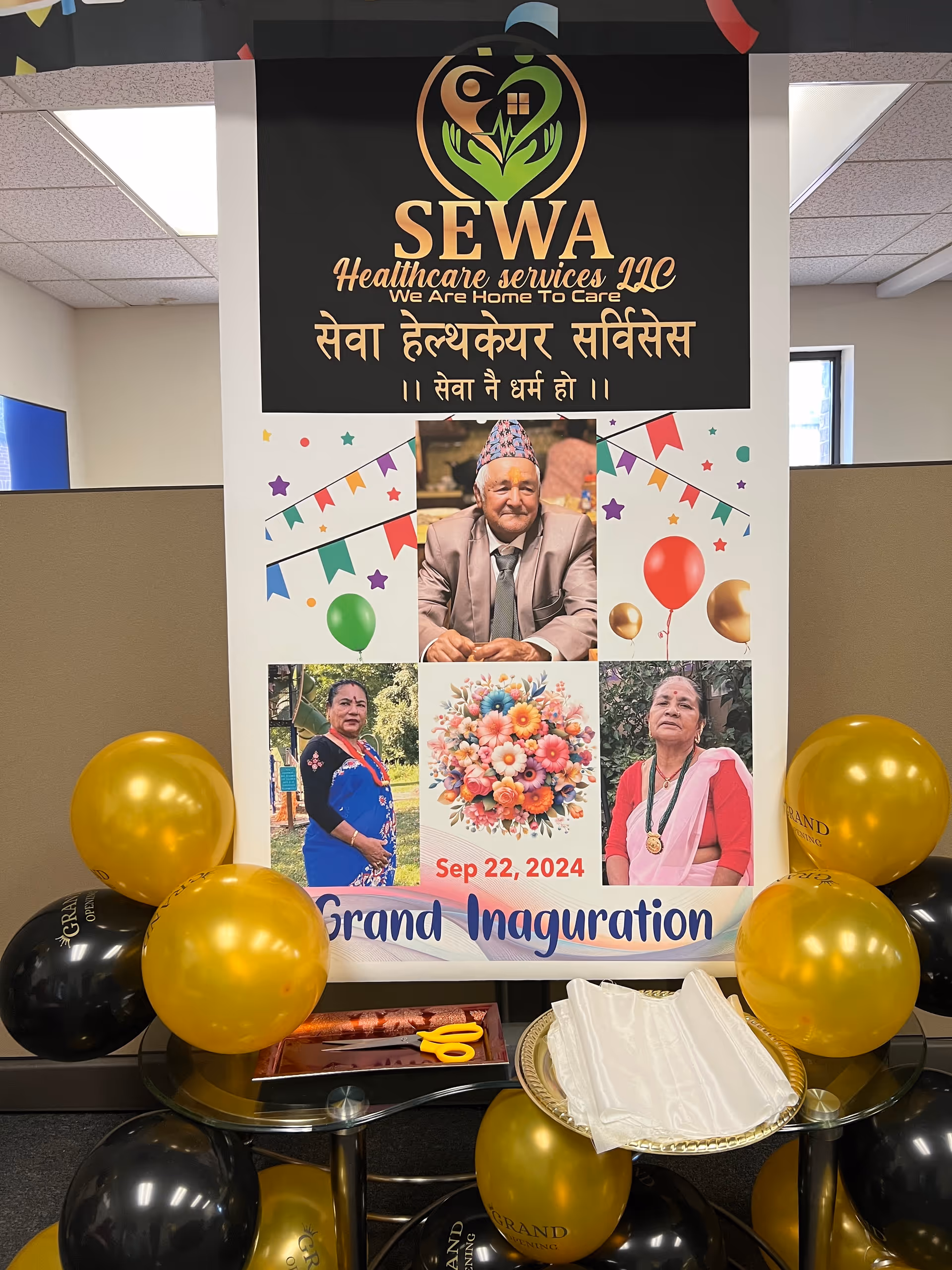 Indoor display board with balloons and seniors poster for SEWA Healthcare grand inauguration