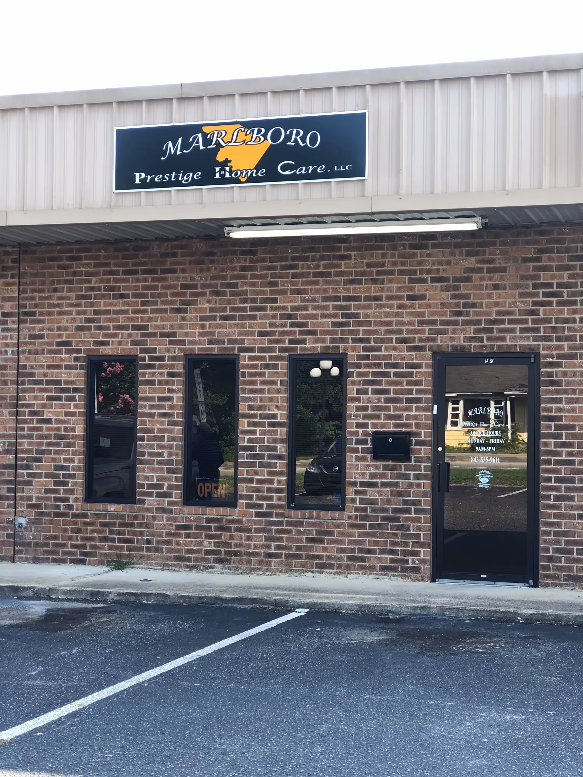 Brick exterior of Marlboro Prestige Home Care LLC with sign above the entrance.