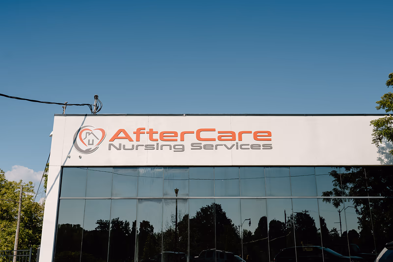 Exterior view of a building with AfterCare Nursing Services sign on the front