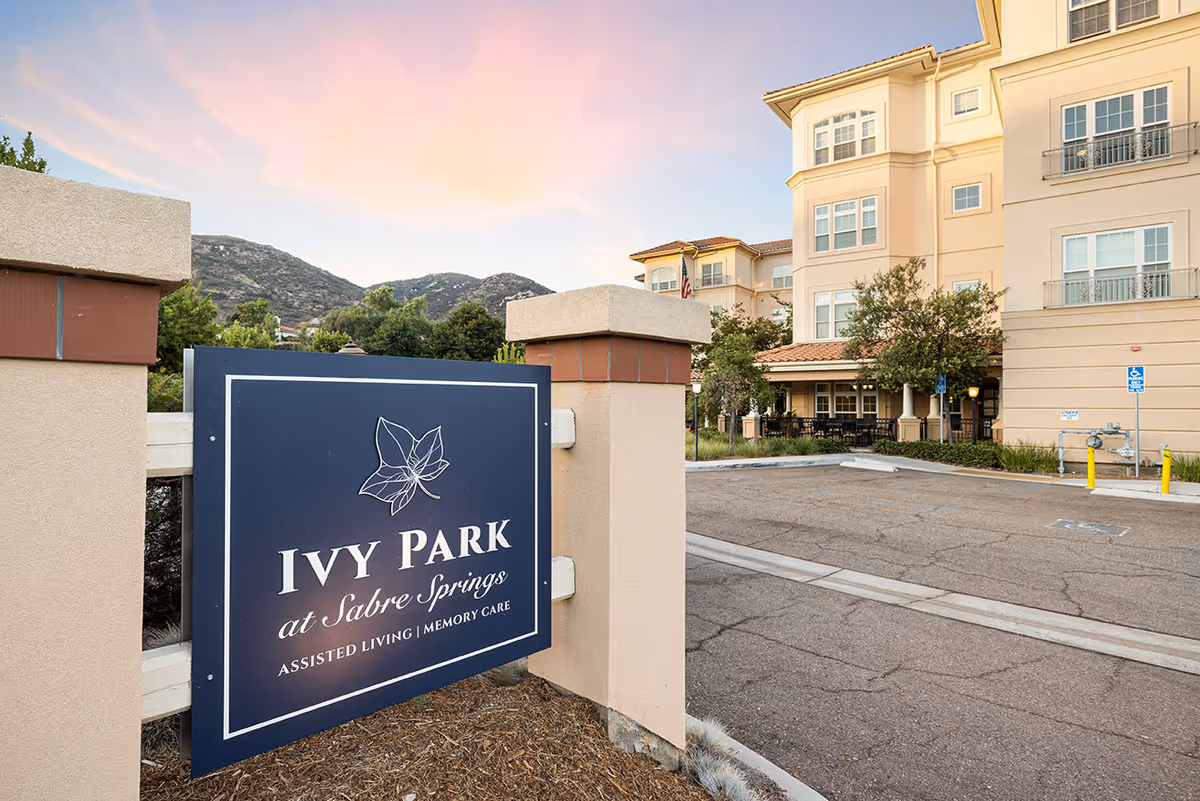 Exterior view of Ivy Park at Sabre Springs assisted living facility with front entrance sign.