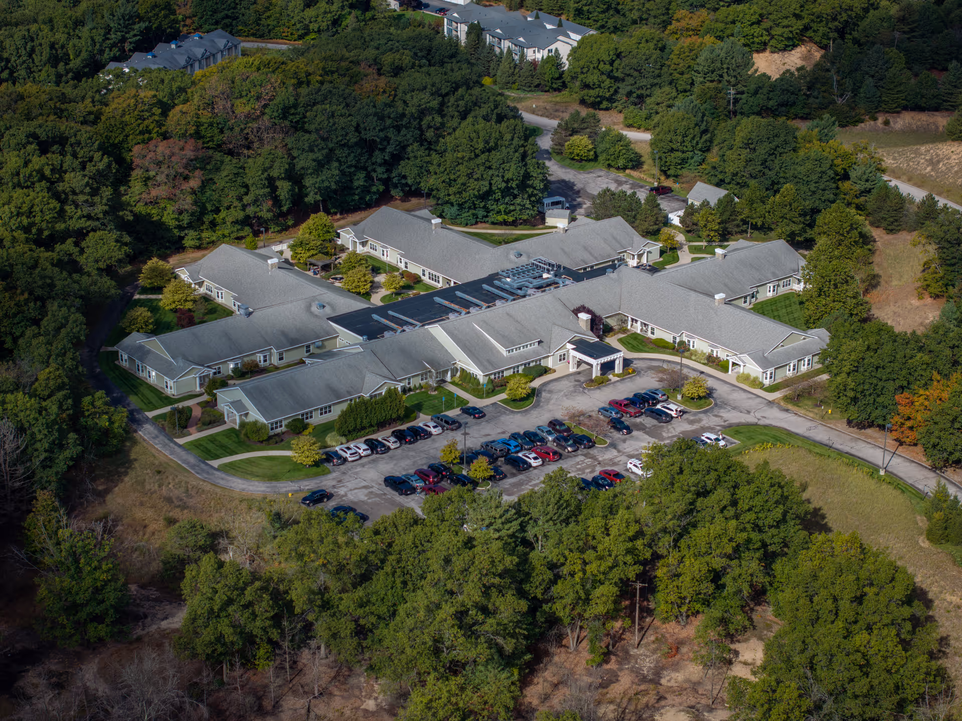 Aerial view of North Ottawa Care Center campus surrounded by trees.