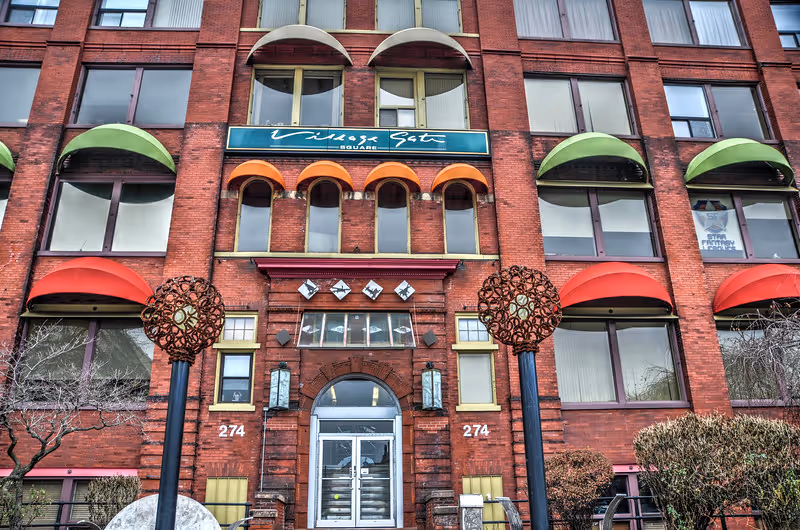 Front view of Burd Home Health building with colorful arched awnings.