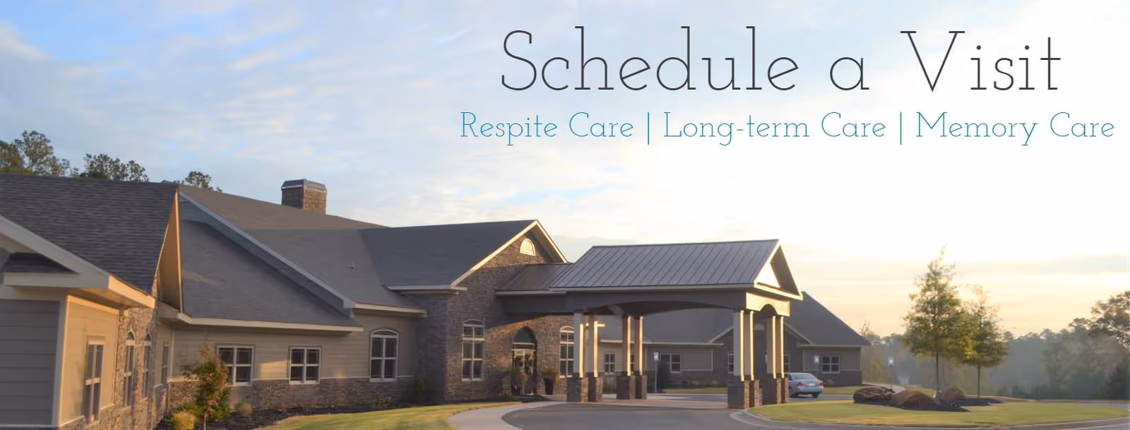 Exterior view of River Place senior living facility with driveway, entrance, and parked cars.