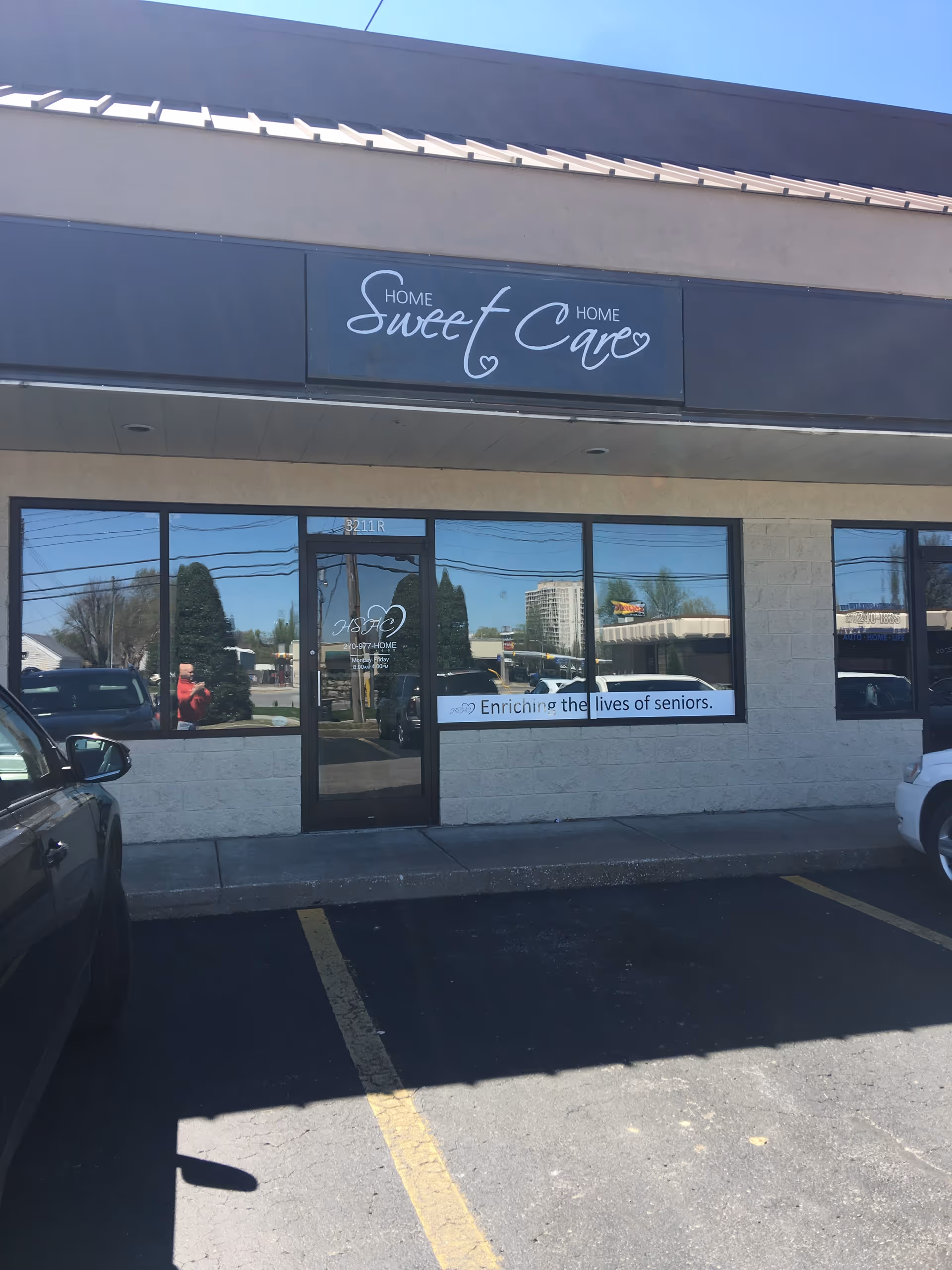 Exterior storefront of Home Sweet Care with glass door and signage.