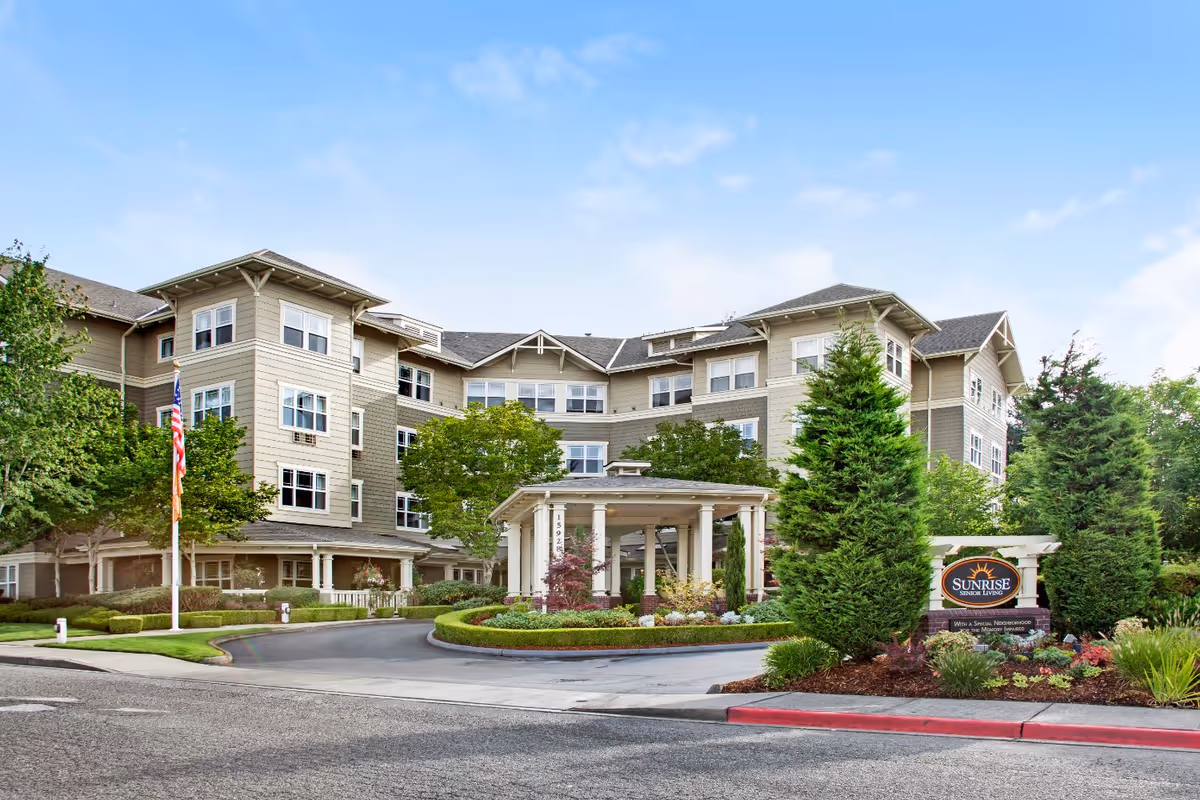 Sunrise of Bellevue senior living facility exterior with entrance and manicured landscaping