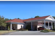 Front exterior of Autumn Lake Healthcare at Bucks Hill with a covered entrance.