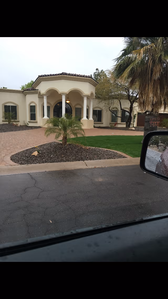 Front view of My Home Sweet Home Assisted Living of Scottsdale with arches and palms.