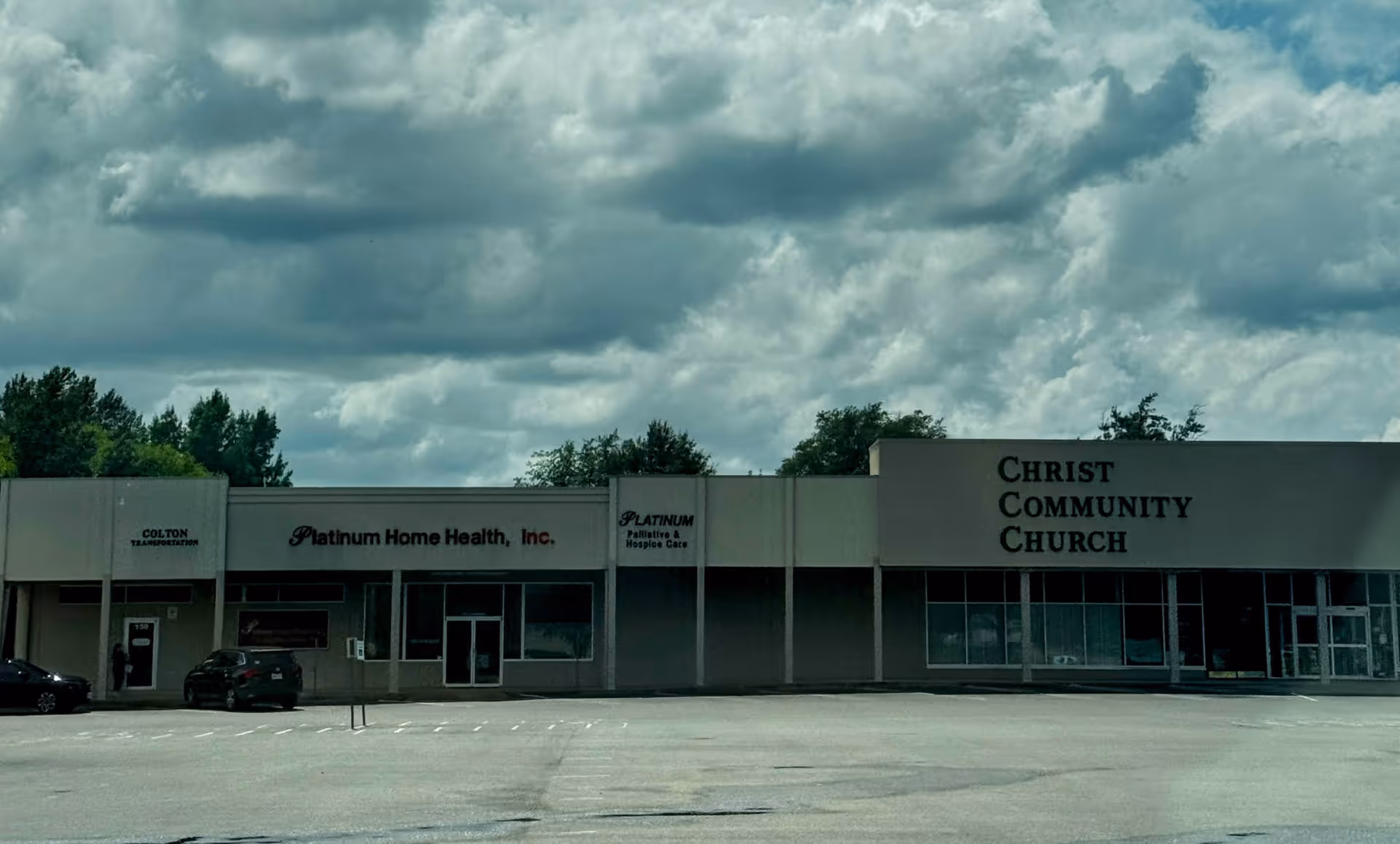 Exterior of a storefront strip mall featuring Platinum Home Health, Inc. and Christ Community Church.