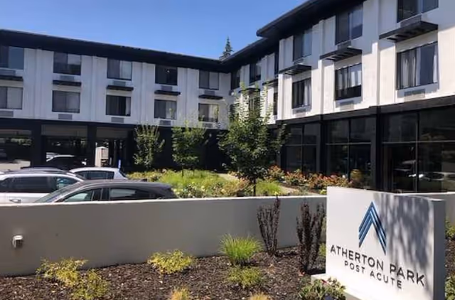 Modern two story medical facility with a sign reading Atherton Park Post Acute.