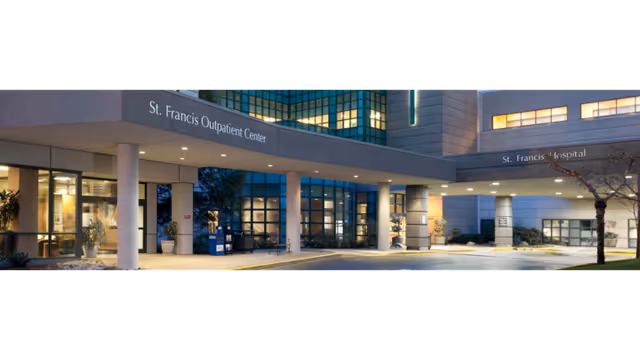 Exterior view of St. Francis Outpatient Center entrance with glass doors and covered drop-off.