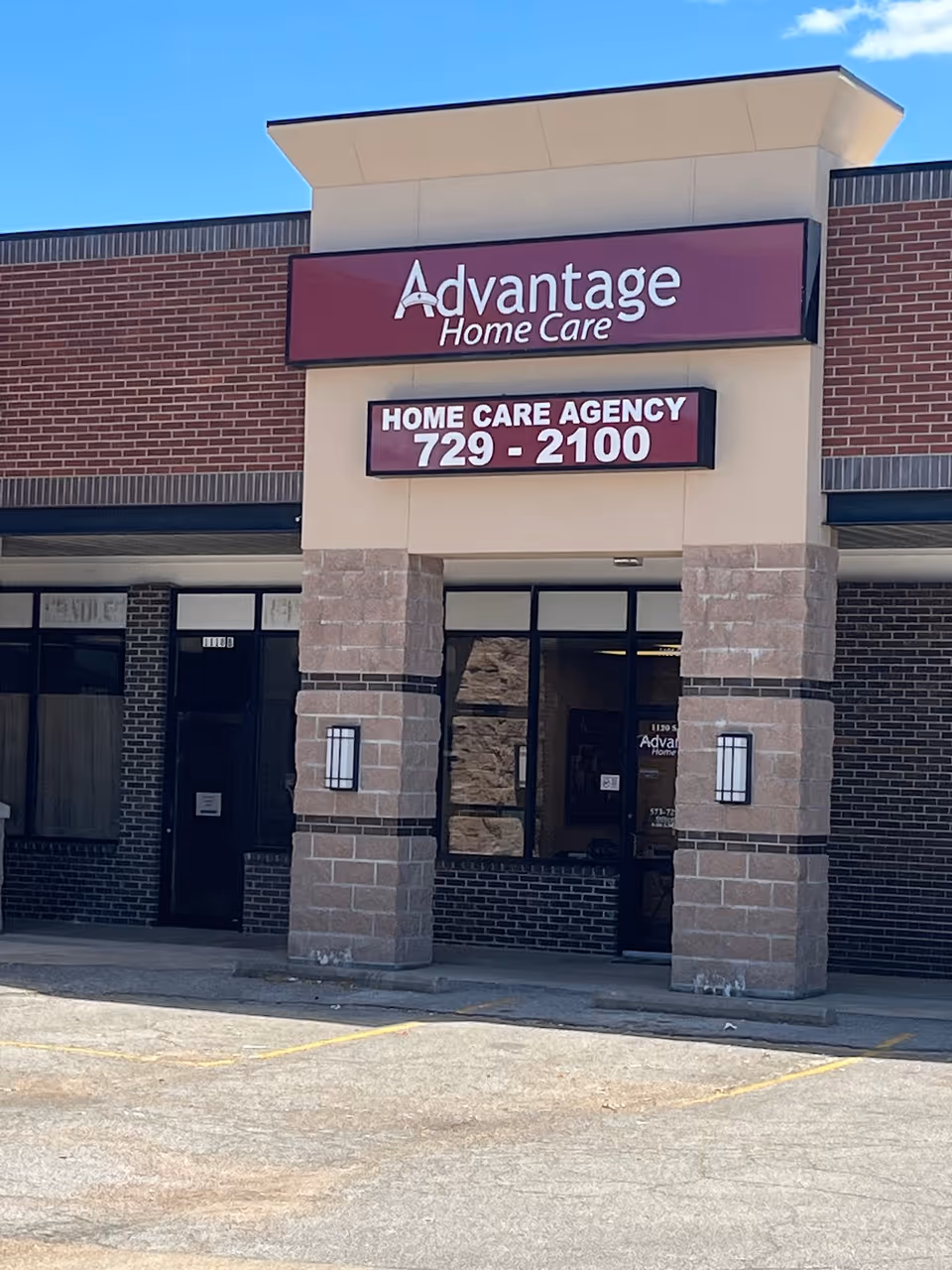 Front view of Advantage Home Care building with brick facade and lobby signage.