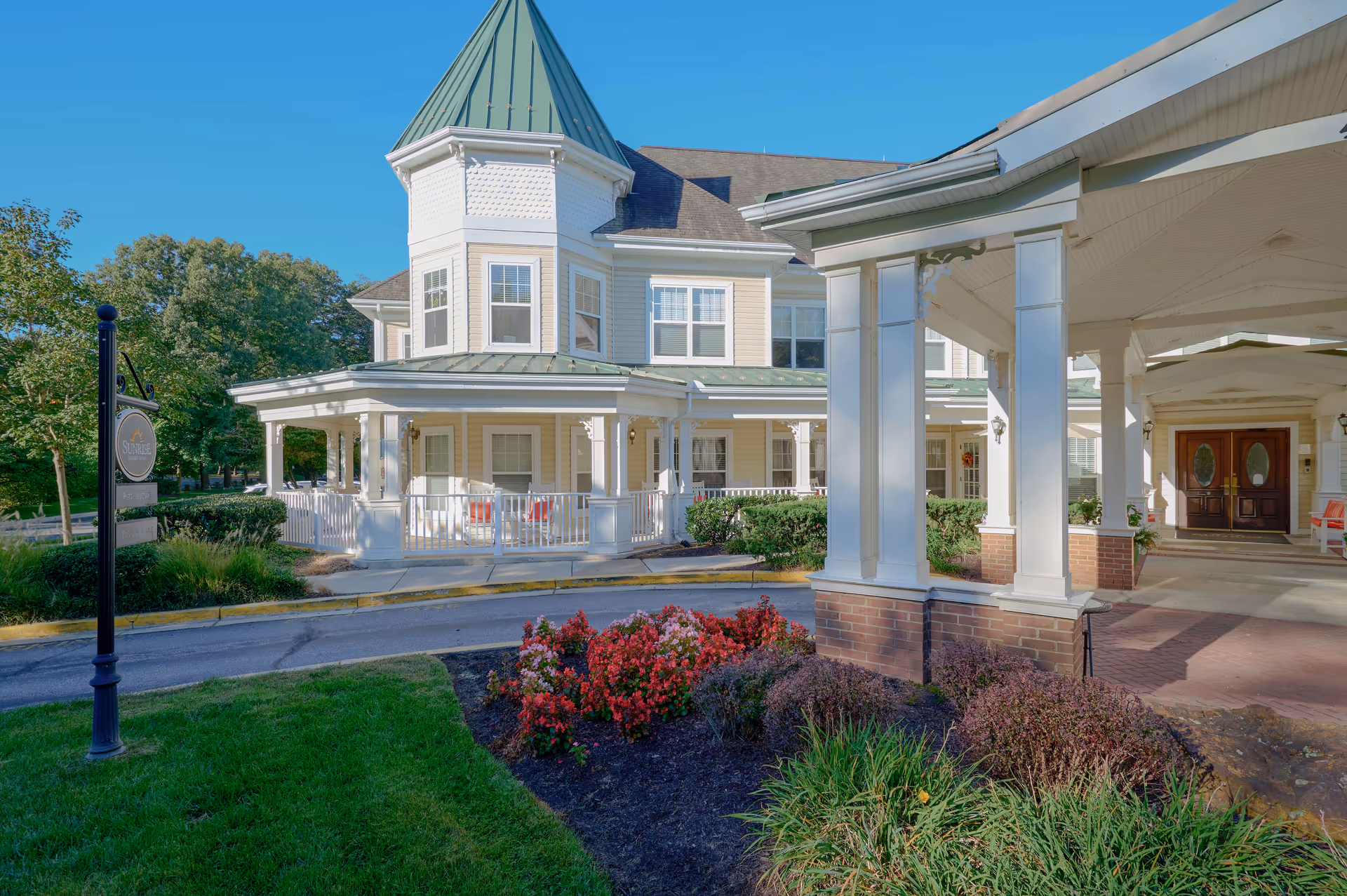Sunrise of Severna Park building exterior with covered entrance and landscaped front yard.
