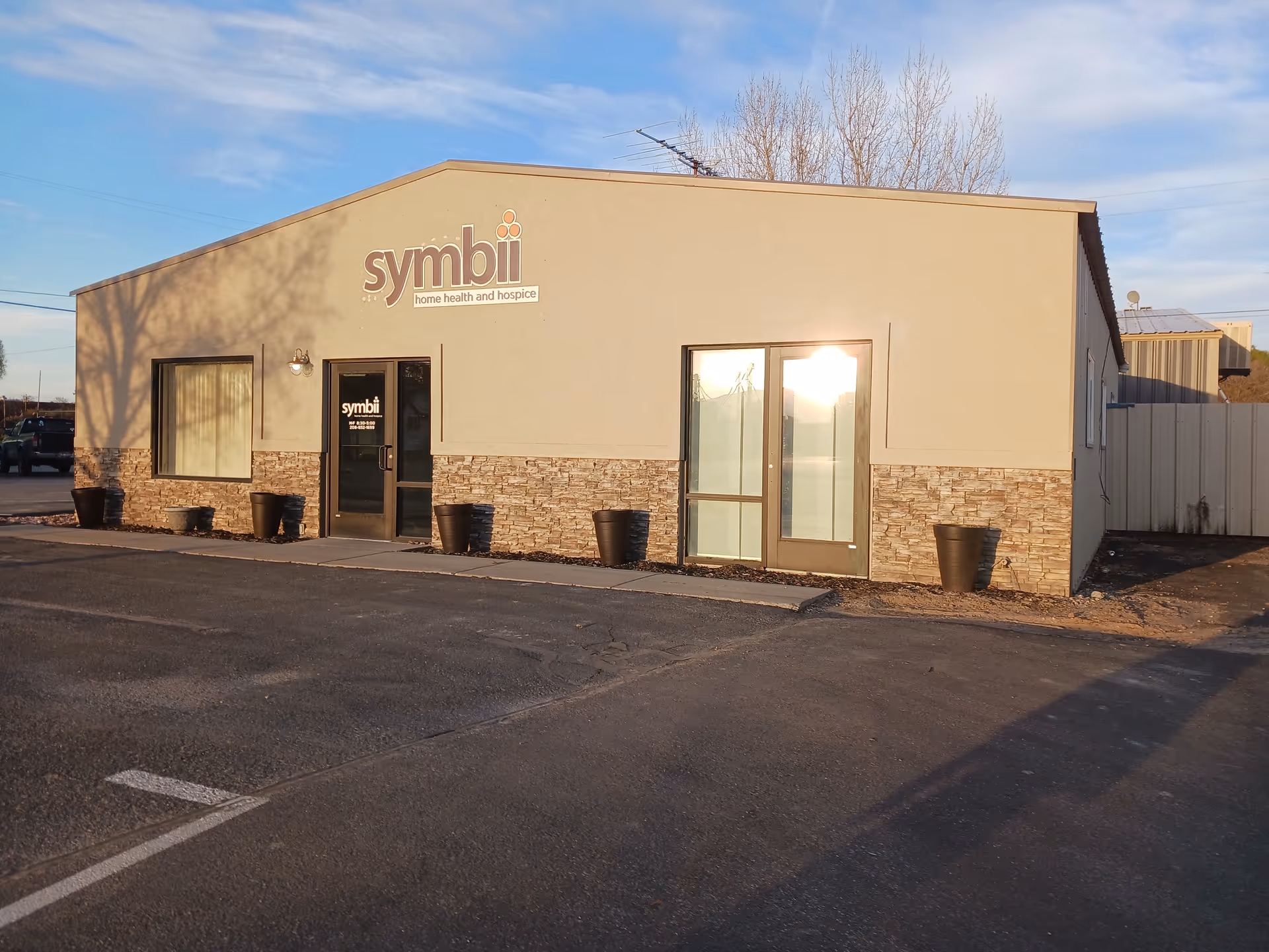 Single story building with Symbii Home Health and Hospice sign and entrance.