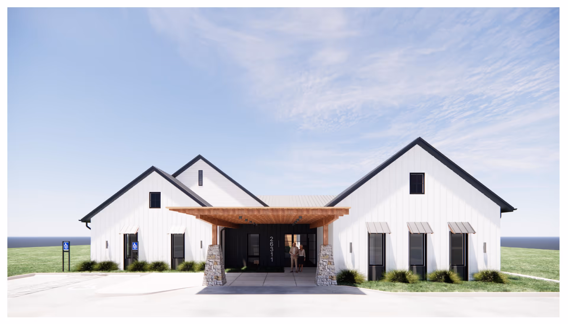 White modern senior living facility exterior with peaked-roof entrances and two people near entry.