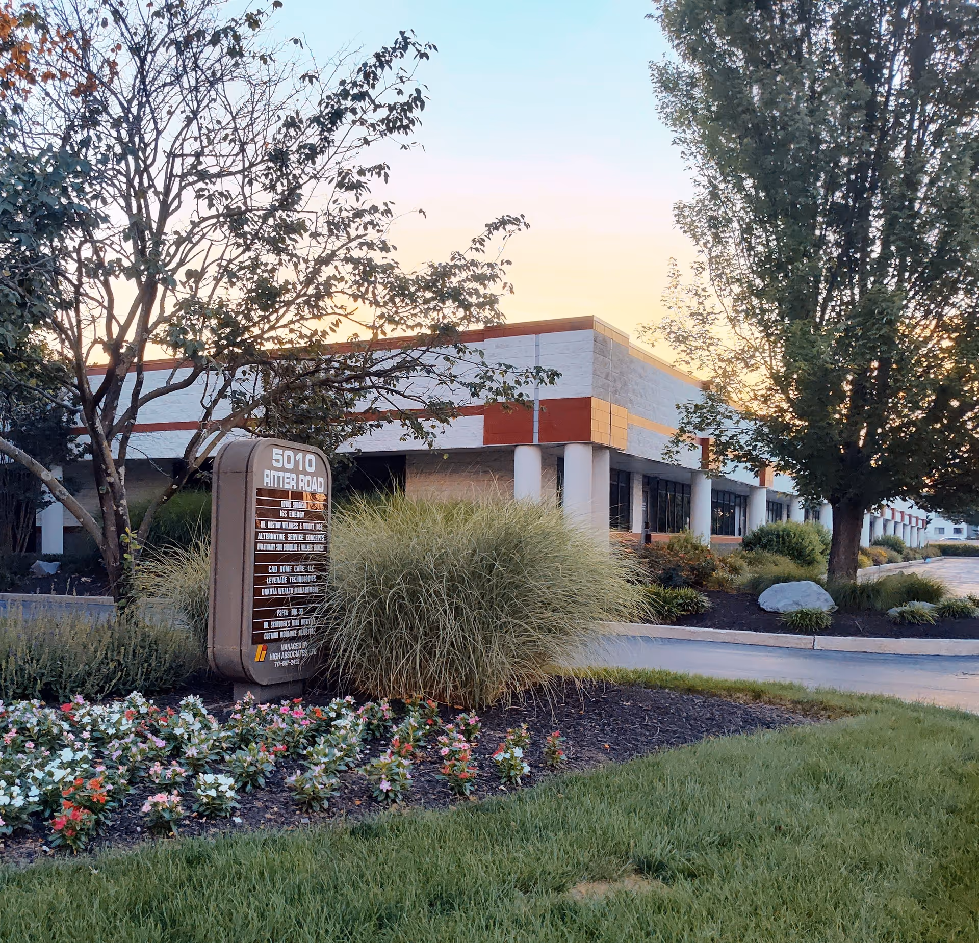 Exterior view of Cad Home Care, LLC facility with landscaped front and sign near Ritter Road