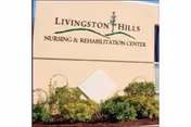 Livingston Hills Nursing & Rehabilitation Center sign with landscaping in front.