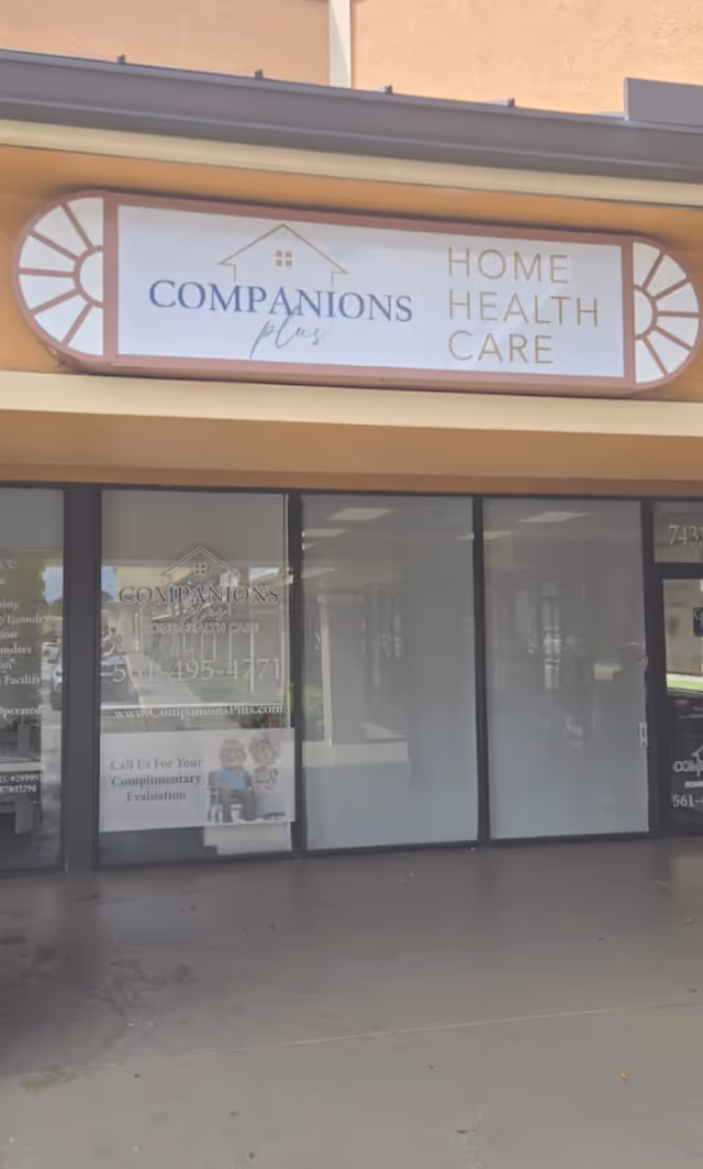 Exterior storefront signage for Companions Plus Home Health Care above glass entrance.