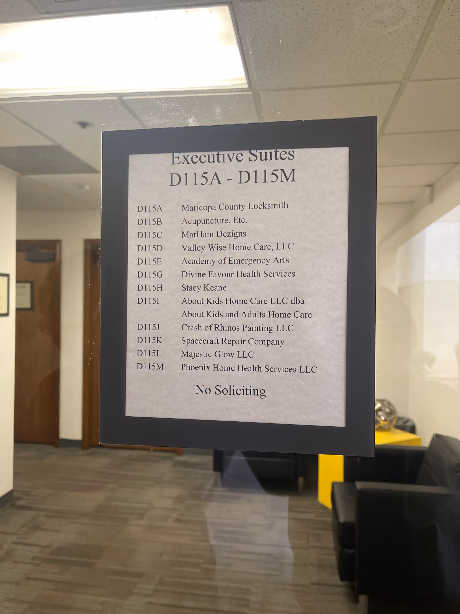 Interior hallway sign listing executive suites and tenants, including Valley Wise Home Care LLC.