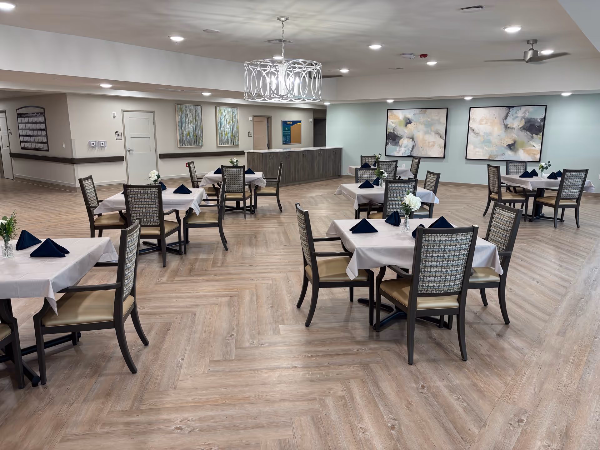 Spacious dining room at The Heights of Magnolia with neatly set tables.