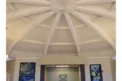 Interior lobby with domed ceiling and radiating beams at Mitchell-Hollingsworth Nursing and Rehabilitation Center.