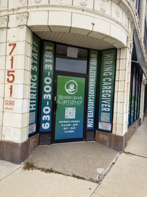 Storefront for Blessing Hands Caregiver with green hiring banners.