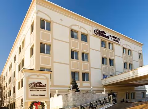 Exterior view of The Bristal Assisted Living at Lynbrook building entrance