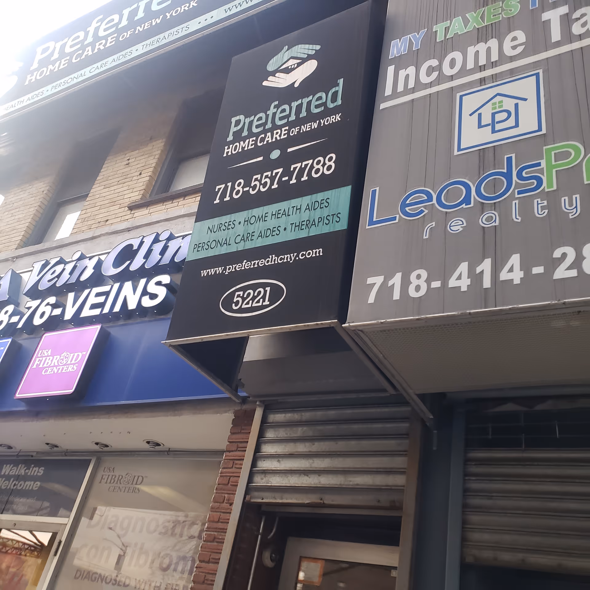 Exterior storefront with Preferred Home Care of New York signage on a Bronx building